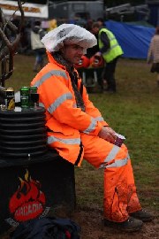 festival goer in rain